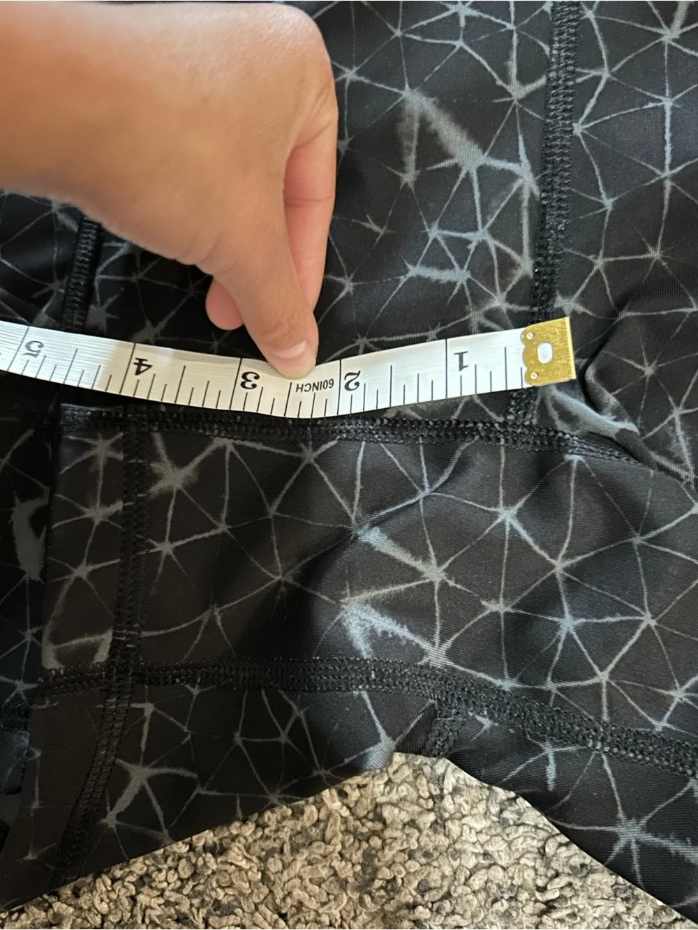 Lululemon What The Sport shorts in a black and grey geometric pattern 4”